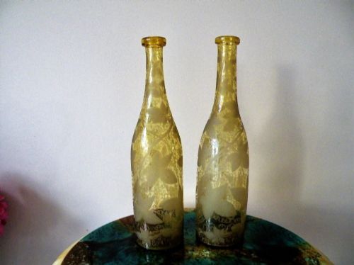 a fine pair of georgian vine engraved glass serving bottles