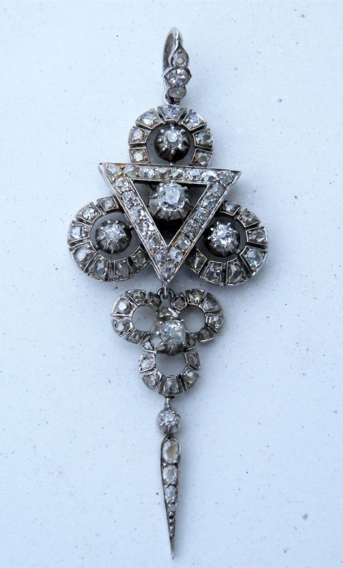 a superb diamond and platinum art deco pendant brooch set in the high art deco odeon style