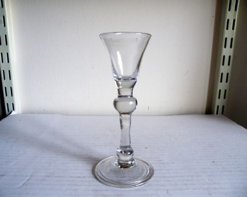 an early 18th century balustroid stem gin glass
