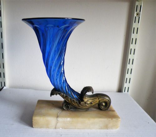 a large single regency cobalt blue glass cornucopia on a marble base