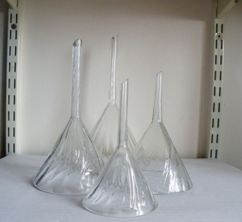 a set of four graduated 19th century wrythen glass wine funnels