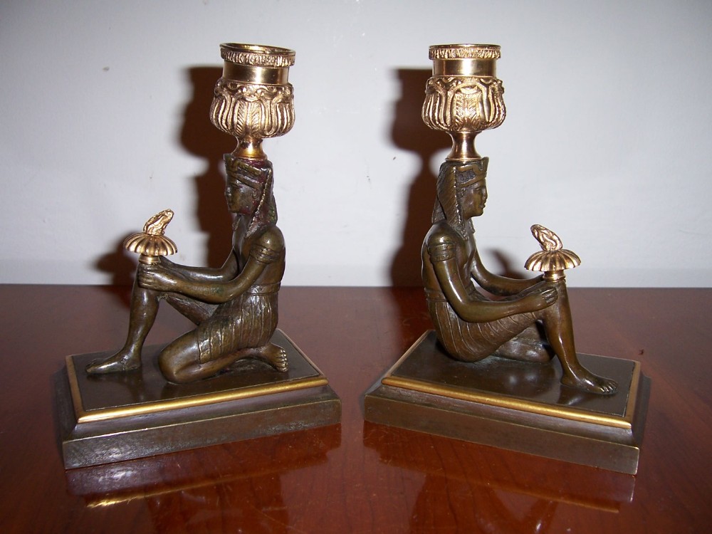 a rare pair of regency bronze and ormolou desk candelsticks