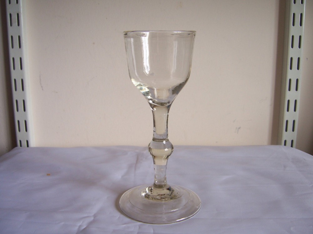 an 18th century knopped stem wine glass with folded foot