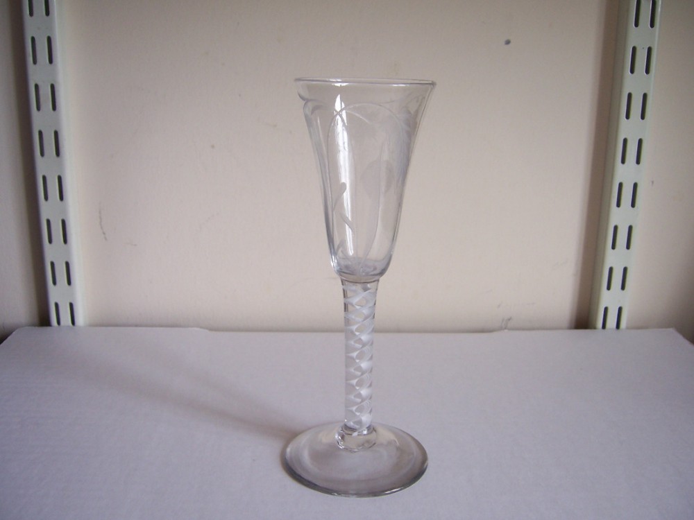 an 18th century opaque twist stem engraved tall ale glass
