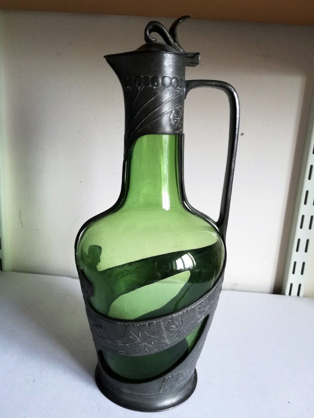 a good art nouveau pewter and glass claret jug in the style of tudric for liberty's