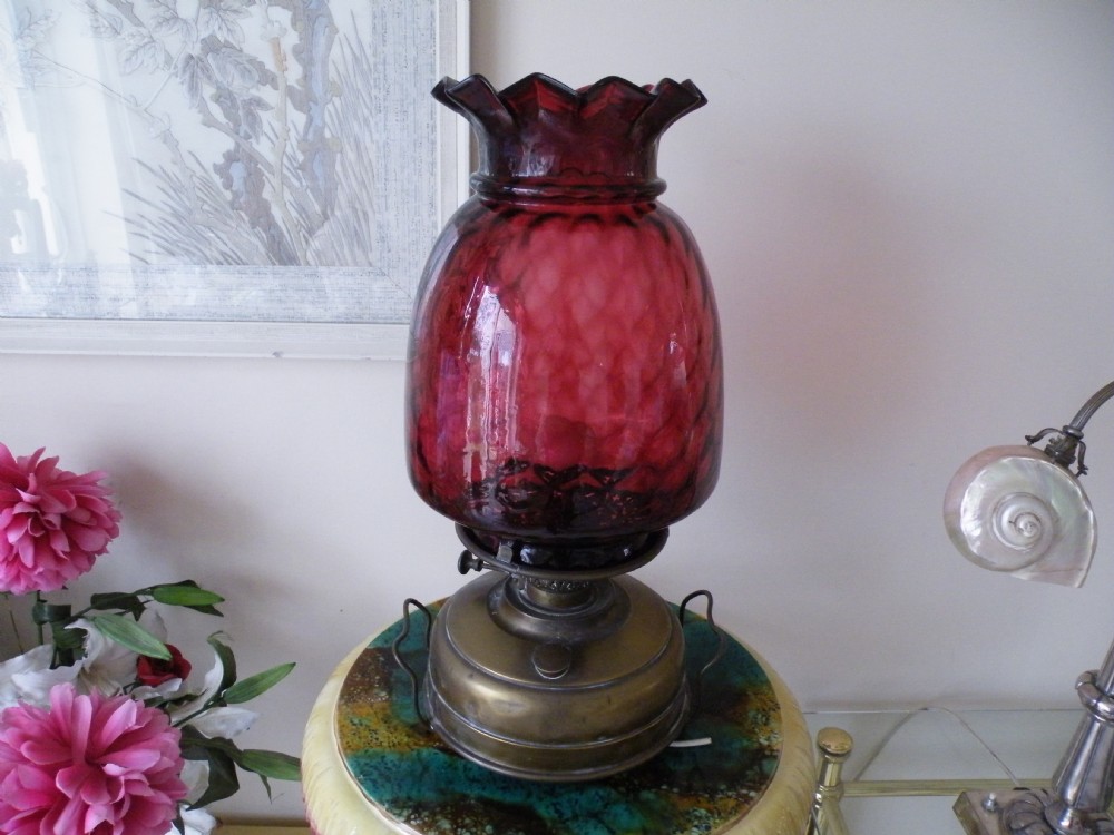 a large victorian ruby glass and brass oil lamp heater