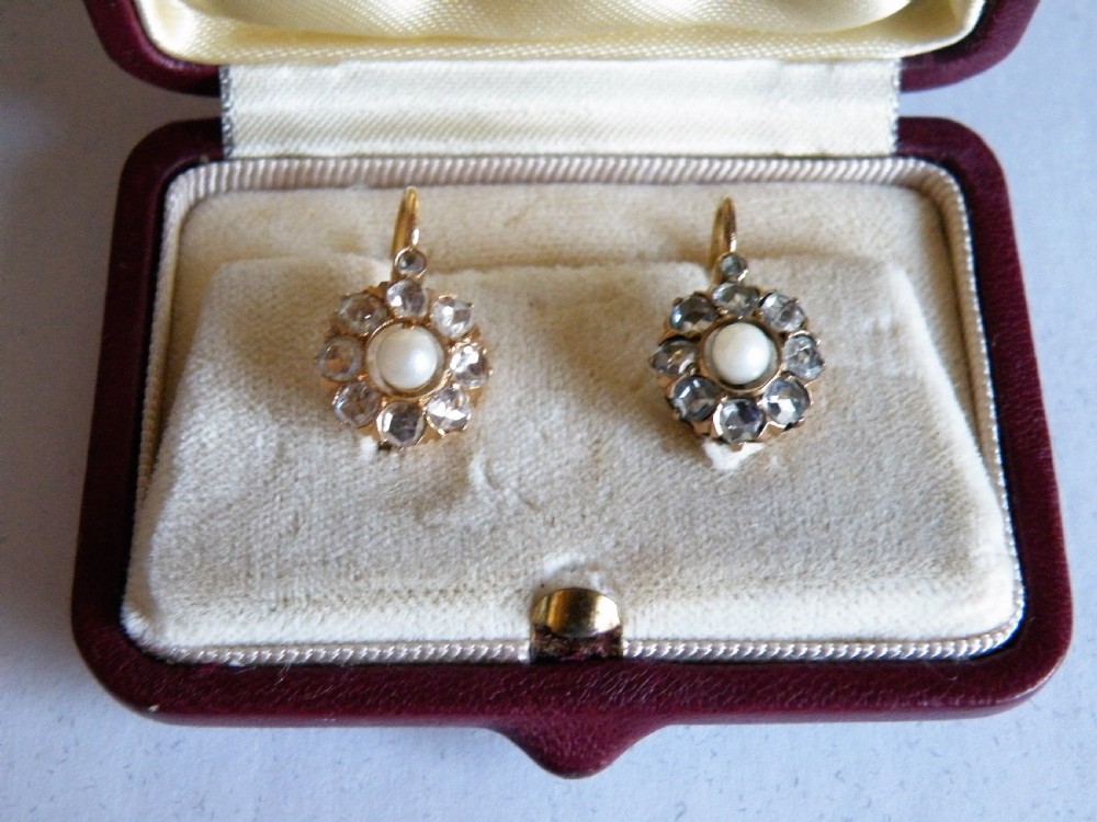 a good pair of victorian rose cut diamond and pearl earrings set in 18 carat gold
