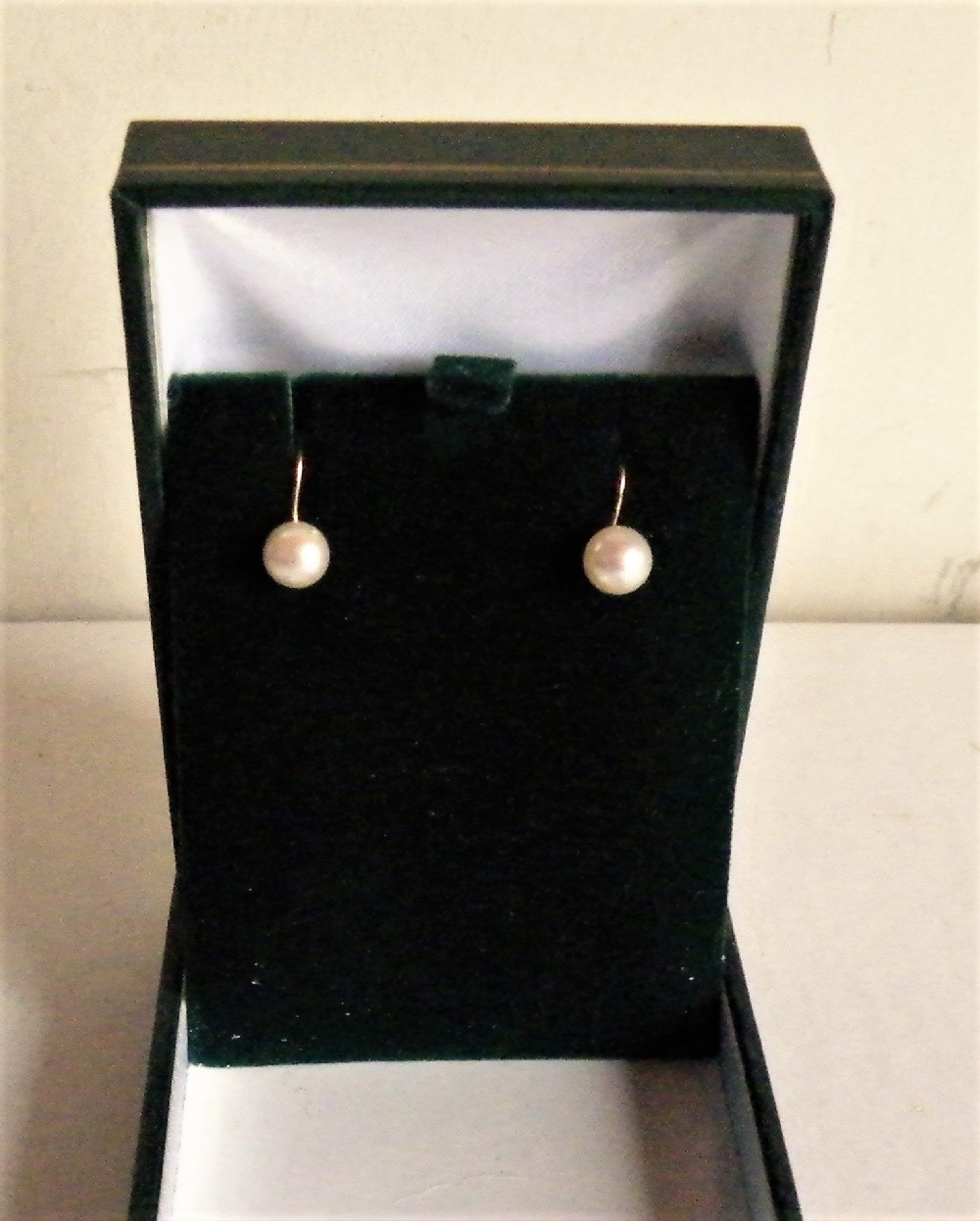 a pair of vintage gold mounted single pearl screw on stud earrings