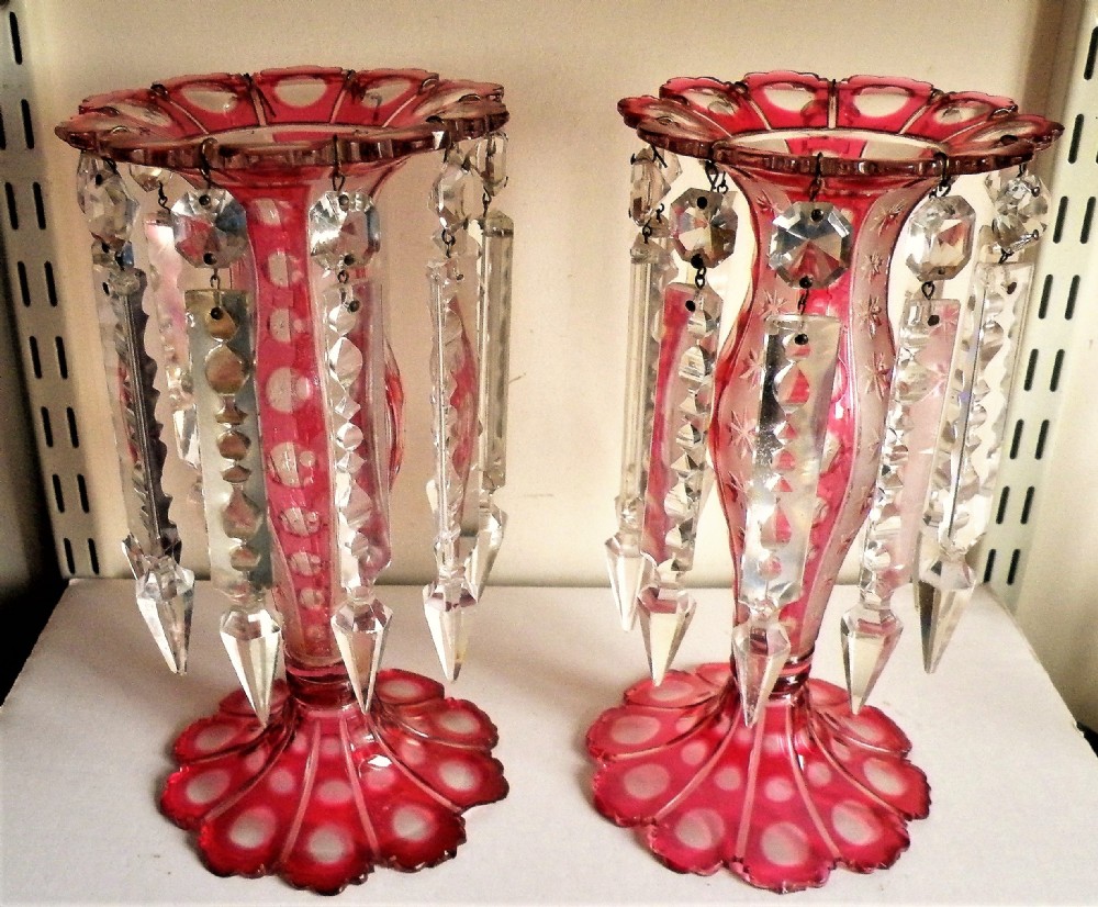 a pretty pair of 19th century overlaid cranberry glass cut to clear lusters