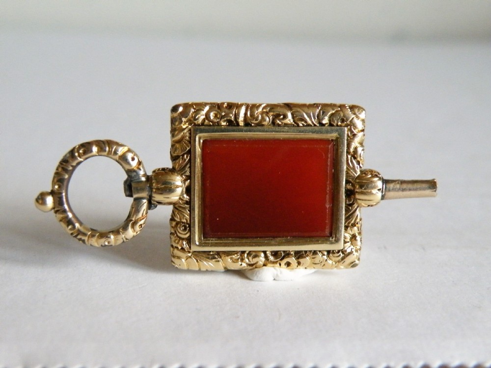 a good large georgian gold and cornelian watch key