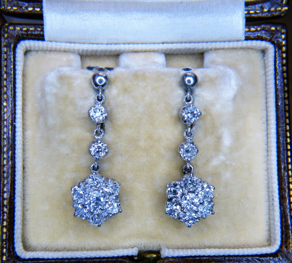a pair of edwardian diamond and platinum cluster drop earrings