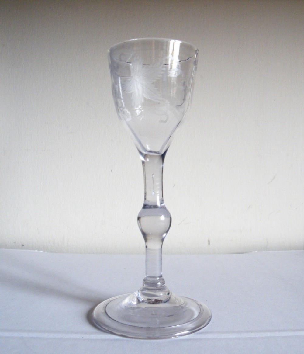 an 18th century balustroid stem engraved wine glass