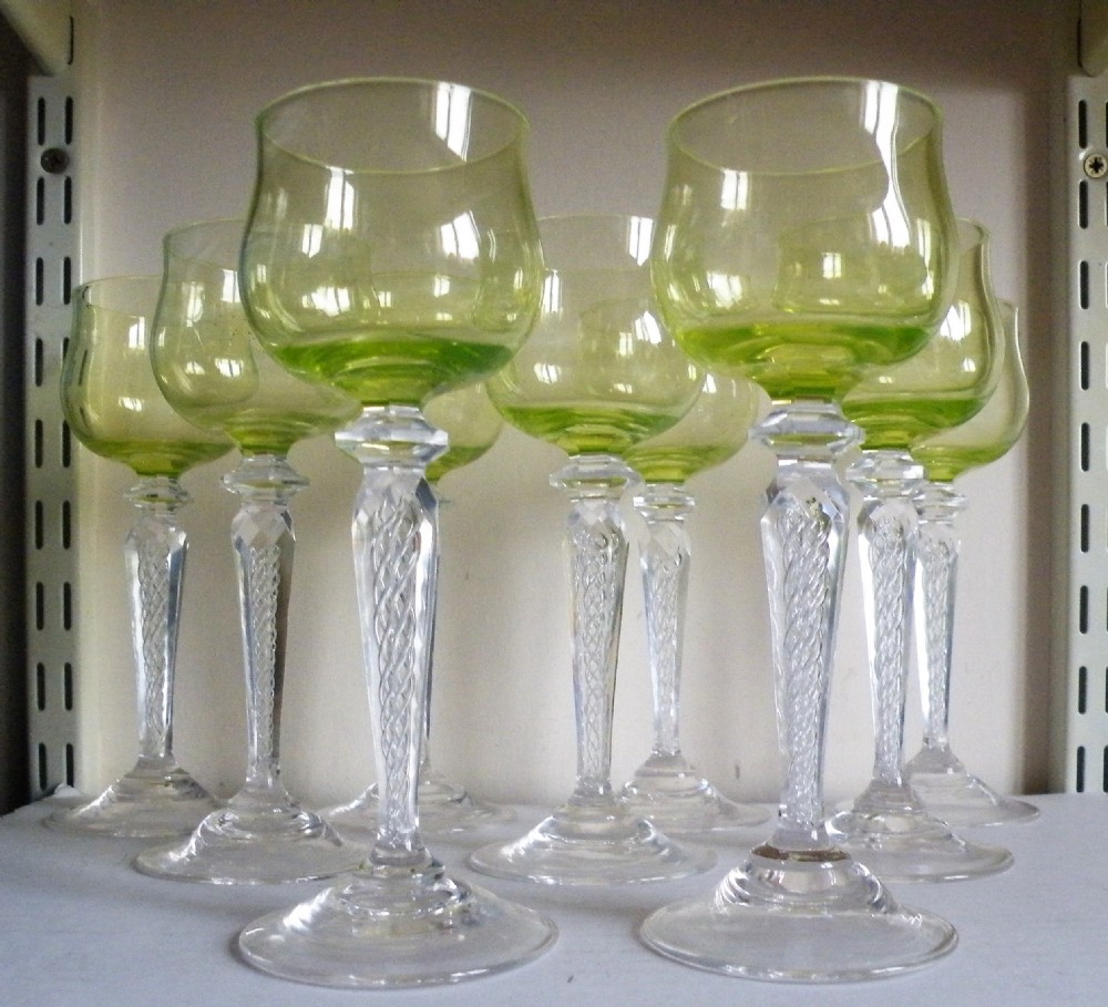 a good set of nine edwardian vaseline bowl hock glasses with air twist stems