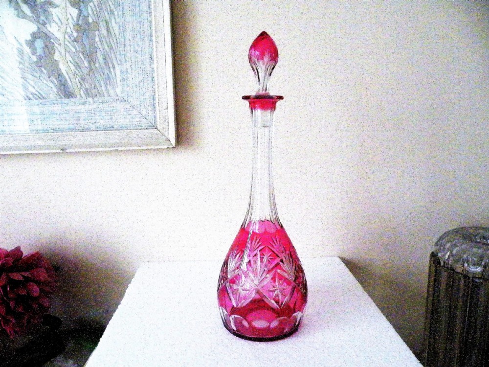 a lovely tall victorian cranberry glass cut to clear decanter