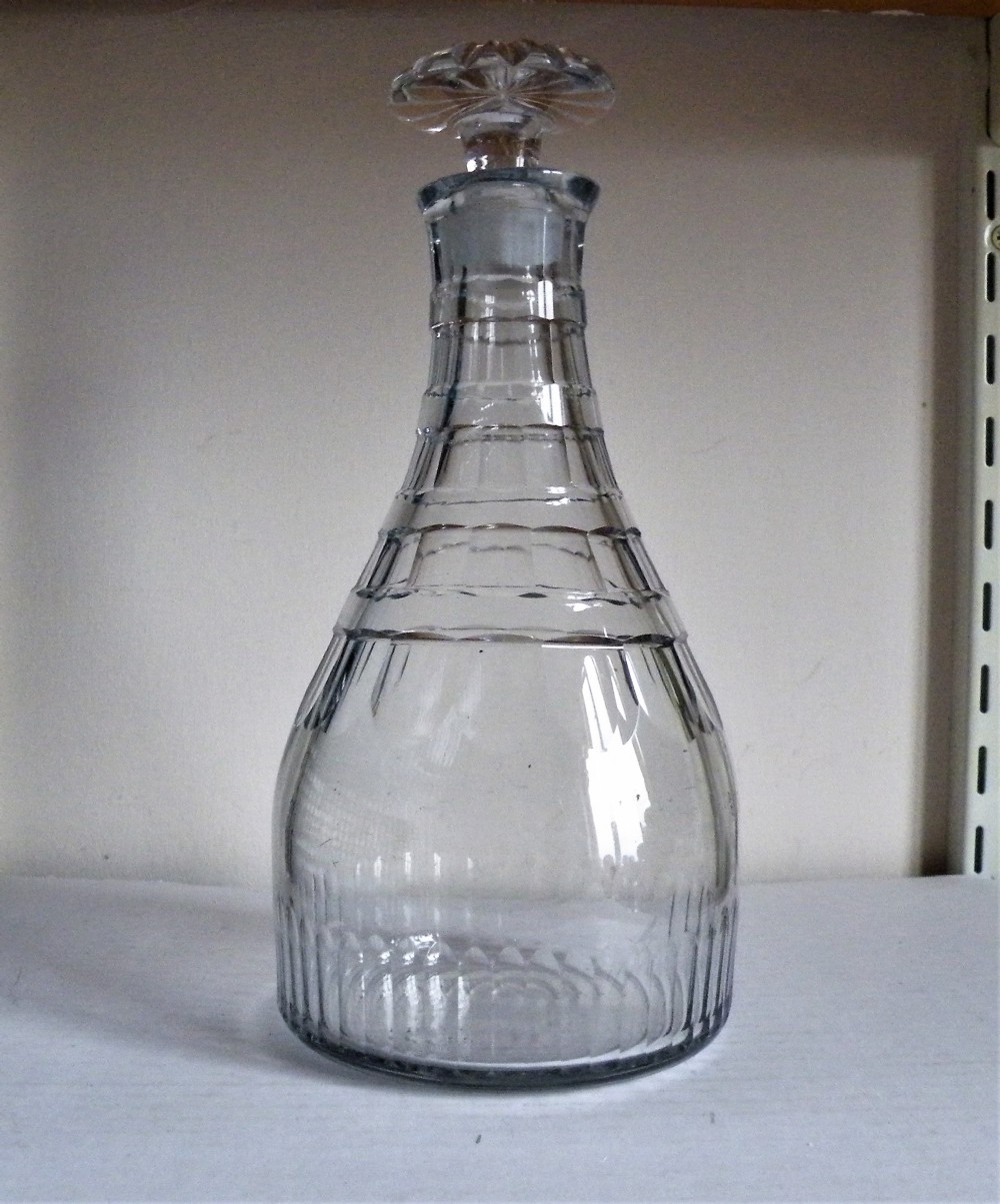 a good georgian heavy cut glass decanter having four neck rings