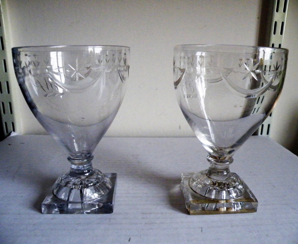 a fine pair of 18th century cut glass rummers with lemon squeezer bases