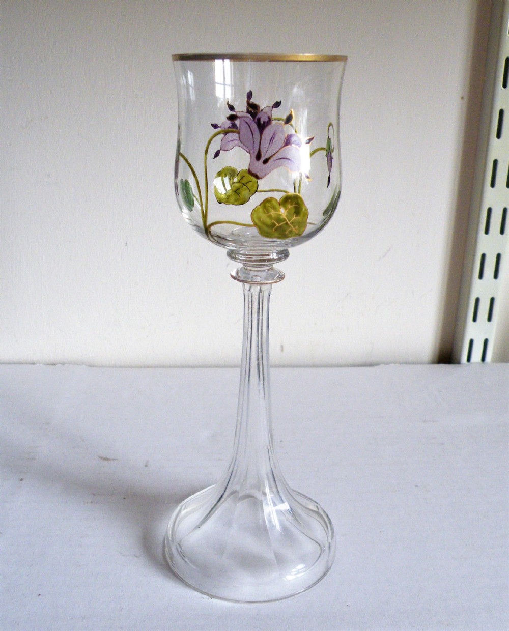 a tall art nouveau thereseinthal austrian hock glass with enamelled flowers circa 1905