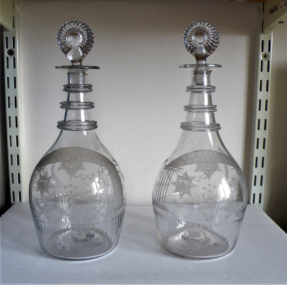 an important and rare pair of irish 18th century masonic glass decanters