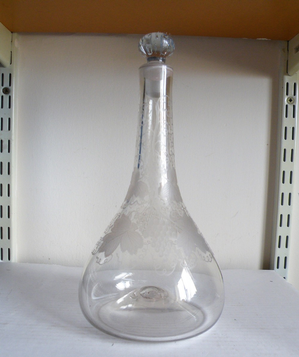 a very rare early 18th century onion shape glass decanter