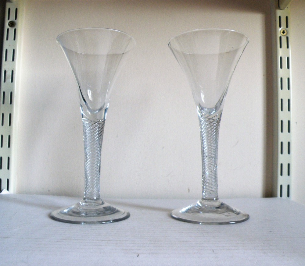 a fine large pair of mid 18th century air twist stem wine glasses circa 1745
