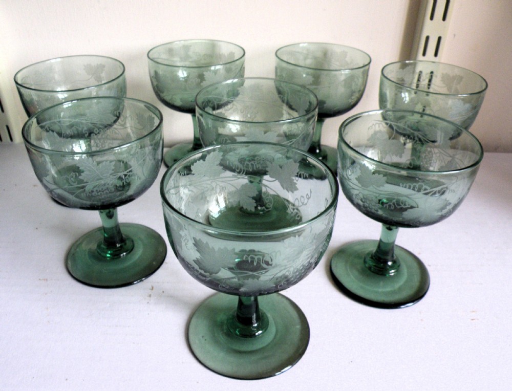 a good set of eight 19th century engraved green glass wine champagne glasses