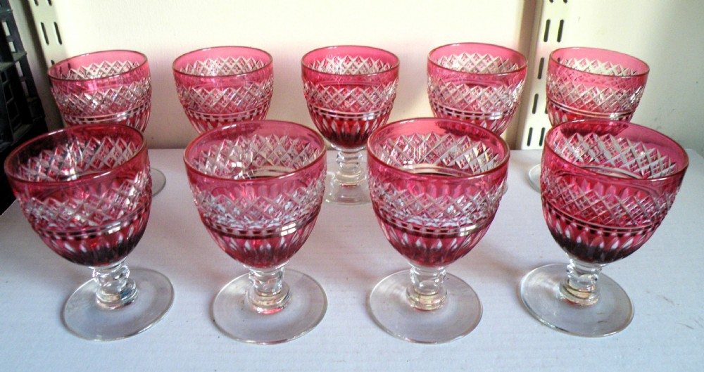 a fine set of 11 victorian cranberry cut to clear wine glasses