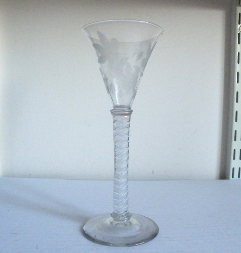 a tall georgian opaque twist stem engraved wine glass