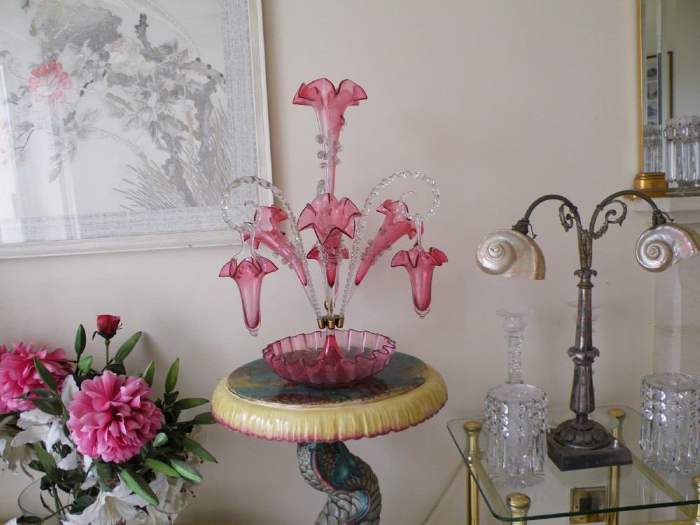 a superb genuine victorian cranberry glass epergne with hanging baskets